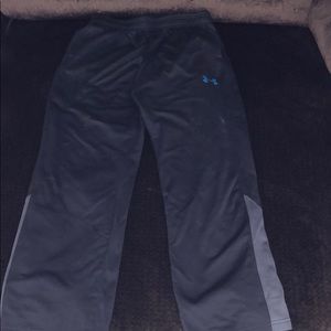 Two pairs of under armour pants for boys